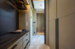 Luxury hotel room with spacious walk-in closet and built-in dresser.