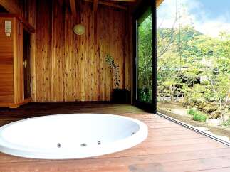 Indulge in ultimate relaxation in this stunning bathroom featuring a luxurious jacuzzi tub and a private sauna.