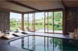 Luxury mountain retreat with indoor pool and stunning views.