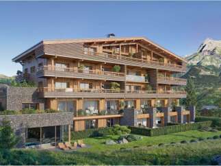 Luxury chalet-style apartments in the French Alps, boasting stunning mountain views and spacious balconies.
