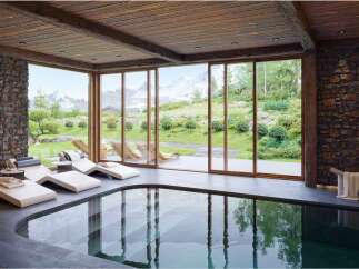 Luxury mountain retreat with indoor pool and stunning views.