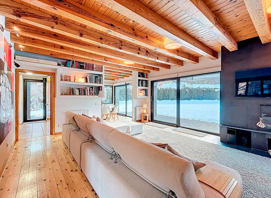 This stunning property boasts a warm and inviting living space, perfect for relaxation and entertaining.