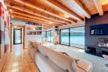 This stunning property boasts a warm and inviting living space, perfect for relaxation and entertaining.