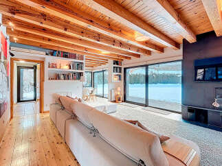 This stunning property boasts a warm and inviting living space, perfect for relaxation and entertaining.
