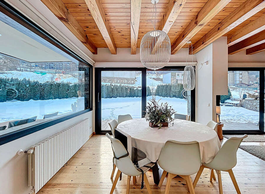 Experience luxury living in this stunning property, featuring a bright and airy dining area.
