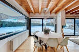 Experience luxury living in this stunning property, featuring a bright and airy dining area.
