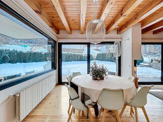 Experience luxury living in this stunning property, featuring a bright and airy dining area.