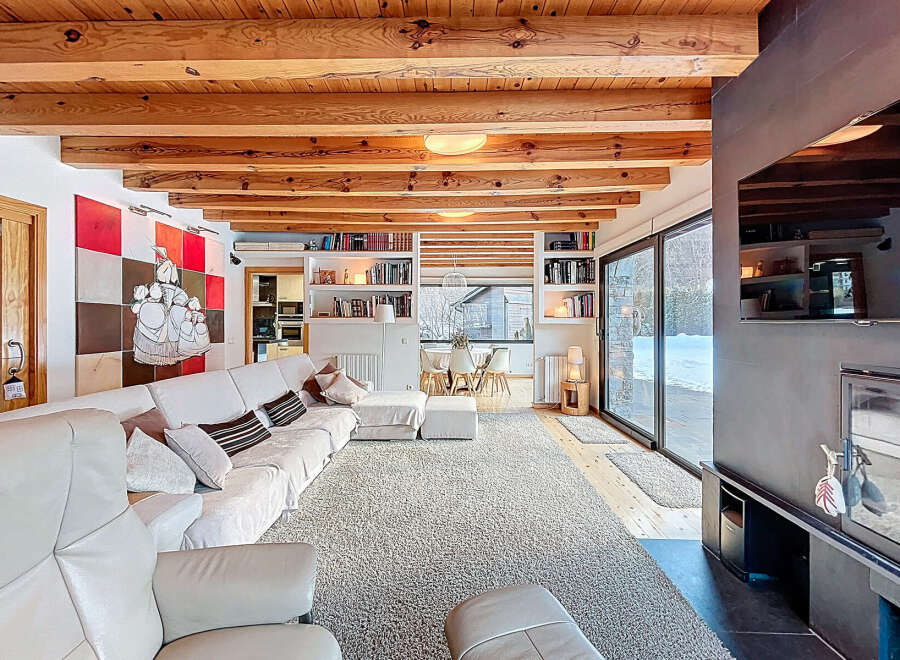 Experience luxury living in this stunning property, featuring a spacious living room with a cozy fireplace and a modern design.
