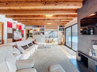Experience luxury living in this stunning property, featuring a spacious living room with a cozy fireplace and a modern design.