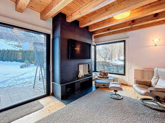 Experience luxury living in this stunning property featuring a cozy fireplace, perfect for chilly evenings.