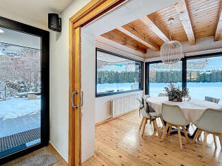 Step into a winter wonderland with this stunning property, featuring a bright and airy dining area.
