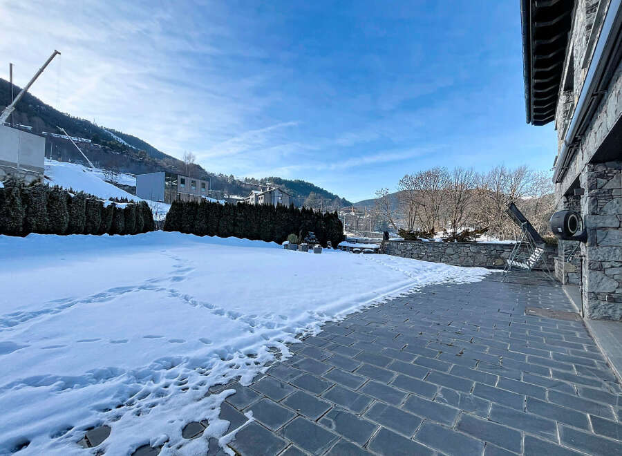 This stunning property boasts a beautiful outdoor space, perfect for enjoying the crisp mountain air.