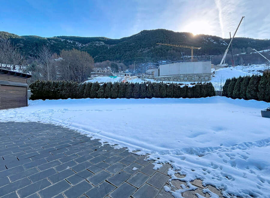 This stunning property offers a serene winter landscape, perfect for those seeking tranquility.