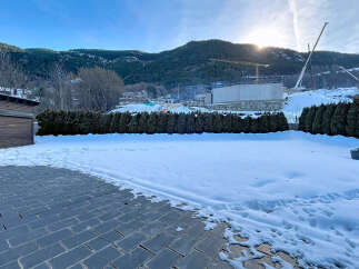This stunning property offers a serene winter landscape, perfect for those seeking tranquility.