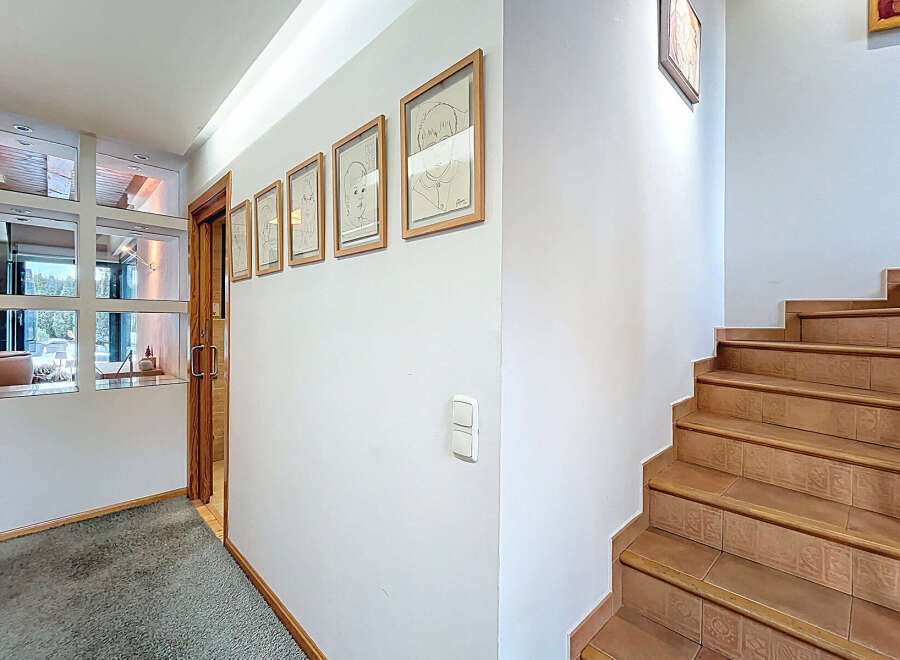 Step into this inviting entryway, showcasing a blend of modern design and natural elements.