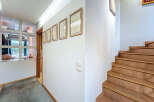 Step into this inviting entryway, showcasing a blend of modern design and natural elements.
