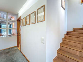 Step into this inviting entryway, showcasing a blend of modern design and natural elements.