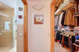 Step into luxury with this stunning property featuring a beautifully designed walk-in closet, perfect for organizing your wardrobe.