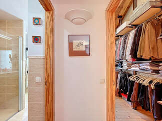 Step into luxury with this stunning property featuring a beautifully designed walk-in closet, perfect for organizing your wardrobe.