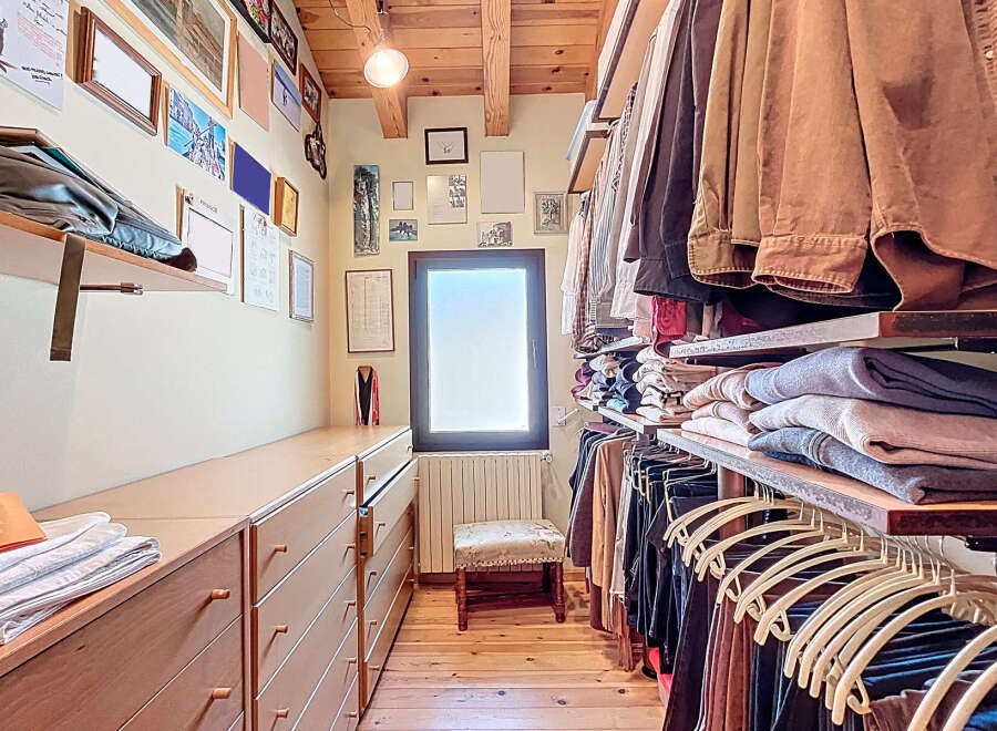 Step into luxury with this stunning walk-in closet, designed for both style and functionality.
