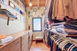 Step into luxury with this stunning walk-in closet, designed for both style and functionality.