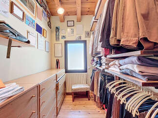 Step into luxury with this stunning walk-in closet, designed for both style and functionality.