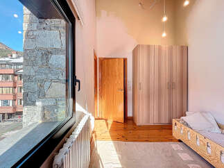 This charming property boasts a bright and airy bedroom with stunning views.