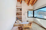 This cozy bedroom features a unique built-in shelving unit, perfect for displaying decor and books.
