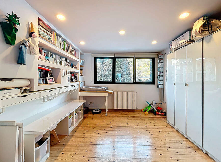 This bright and airy room offers a versatile space, perfect for a home office or creative studio.