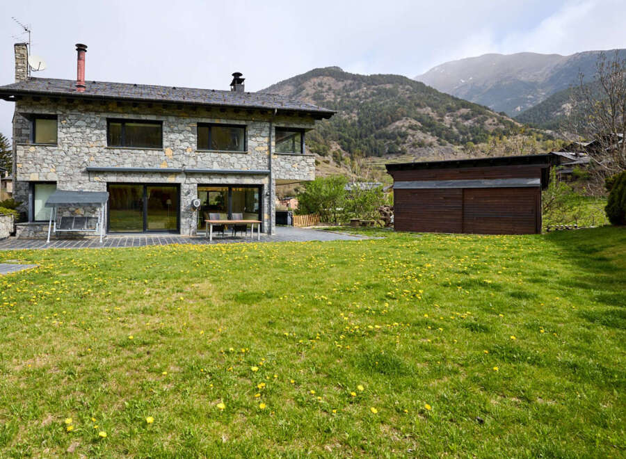 This stunning stone house offers a perfect blend of rustic charm and modern living.