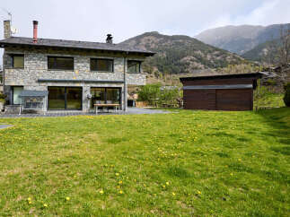 This stunning stone house offers a perfect blend of rustic charm and modern living.
