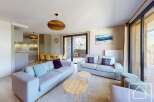 This stunning apartment boasts an open-plan living area with ample natural light, perfect for relaxation.
