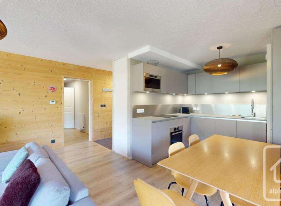 This stunning apartment boasts a modern, open-plan kitchen and living area, perfect for entertaining.