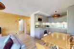 This stunning apartment boasts a modern, open-plan kitchen and living area, perfect for entertaining.