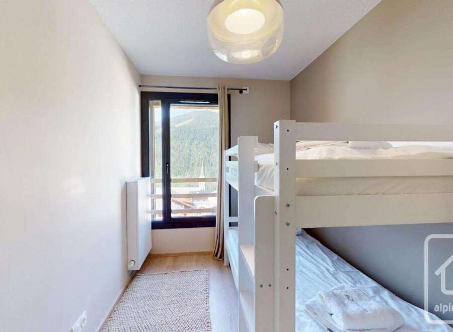 Cozy bunk bed room with stunning mountain views.