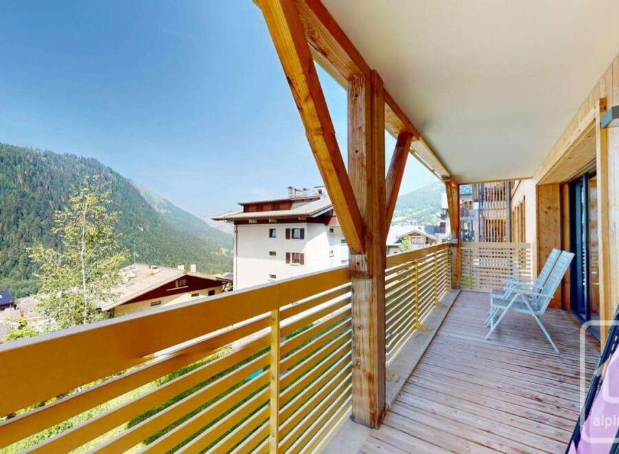 This stunning property boasts a spacious balcony with breathtaking mountain views, perfect for relaxing and enjoying the fresh alpine air.
