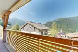 This stunning property boasts a spacious balcony with breathtaking mountain views.