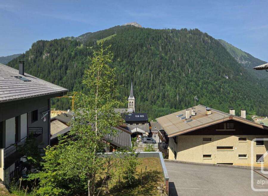 This stunning property boasts breathtaking mountain views and a prime location in a charming village.