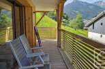 This stunning property boasts a spacious balcony with breathtaking mountain views.