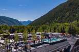 Luxury rooftop pool and lounge with mountain views.