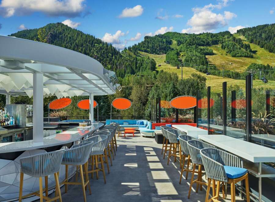 This stunning rooftop bar boasts breathtaking mountain views and a sleek, modern design.