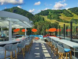 This stunning rooftop bar boasts breathtaking mountain views and a sleek, modern design.