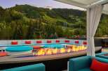 Cozy up by the fire pit on our rooftop terrace, taking in breathtaking mountain views.