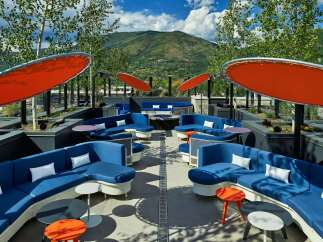 Relax and soak up the sun on our rooftop terrace, complete with comfortable seating, fire pits, and stunning mountain views.