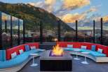 Cozy up by the fire pit on this rooftop lounge, complete with stunning mountain views and comfortable seating.