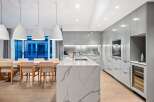 Modern kitchen design with a large island and sleek cabinetry.