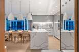 Modern kitchen design with a large island and sleek cabinetry.