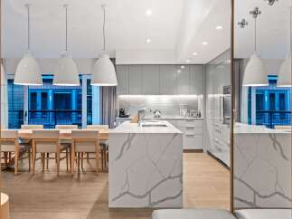 Modern kitchen design with a large island and sleek cabinetry.