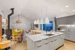 This stunning modern kitchen boasts a sleek design with a large island, perfect for culinary creations and entertaining.