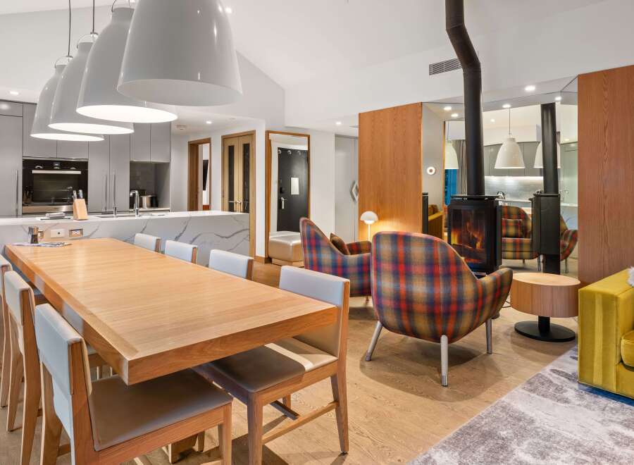 Experience modern luxury in this stunning property, featuring a spacious open-plan living area.